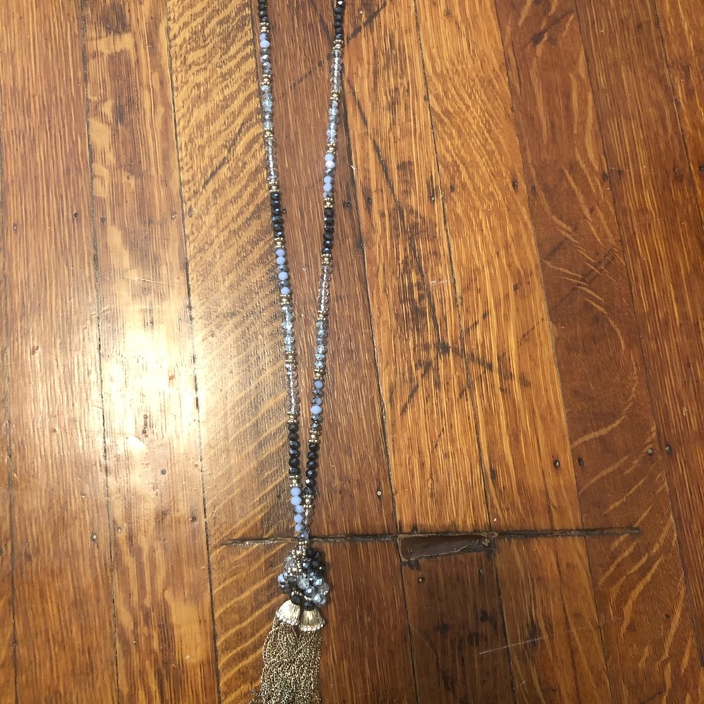Long beaded necklace with gold tassel